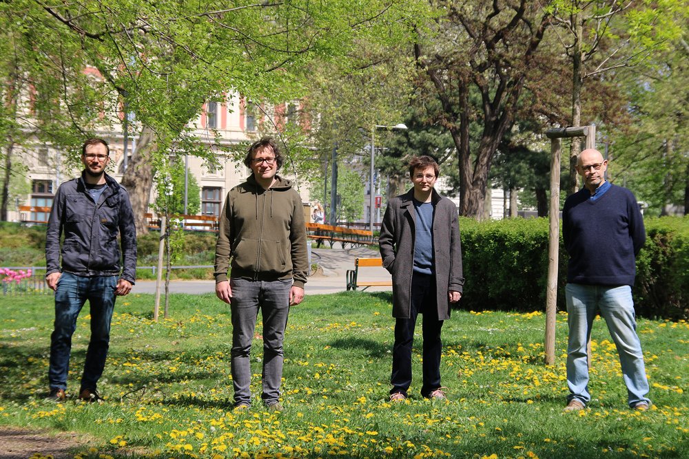 four scientists in the park Karlsplatz nearby TU Wien