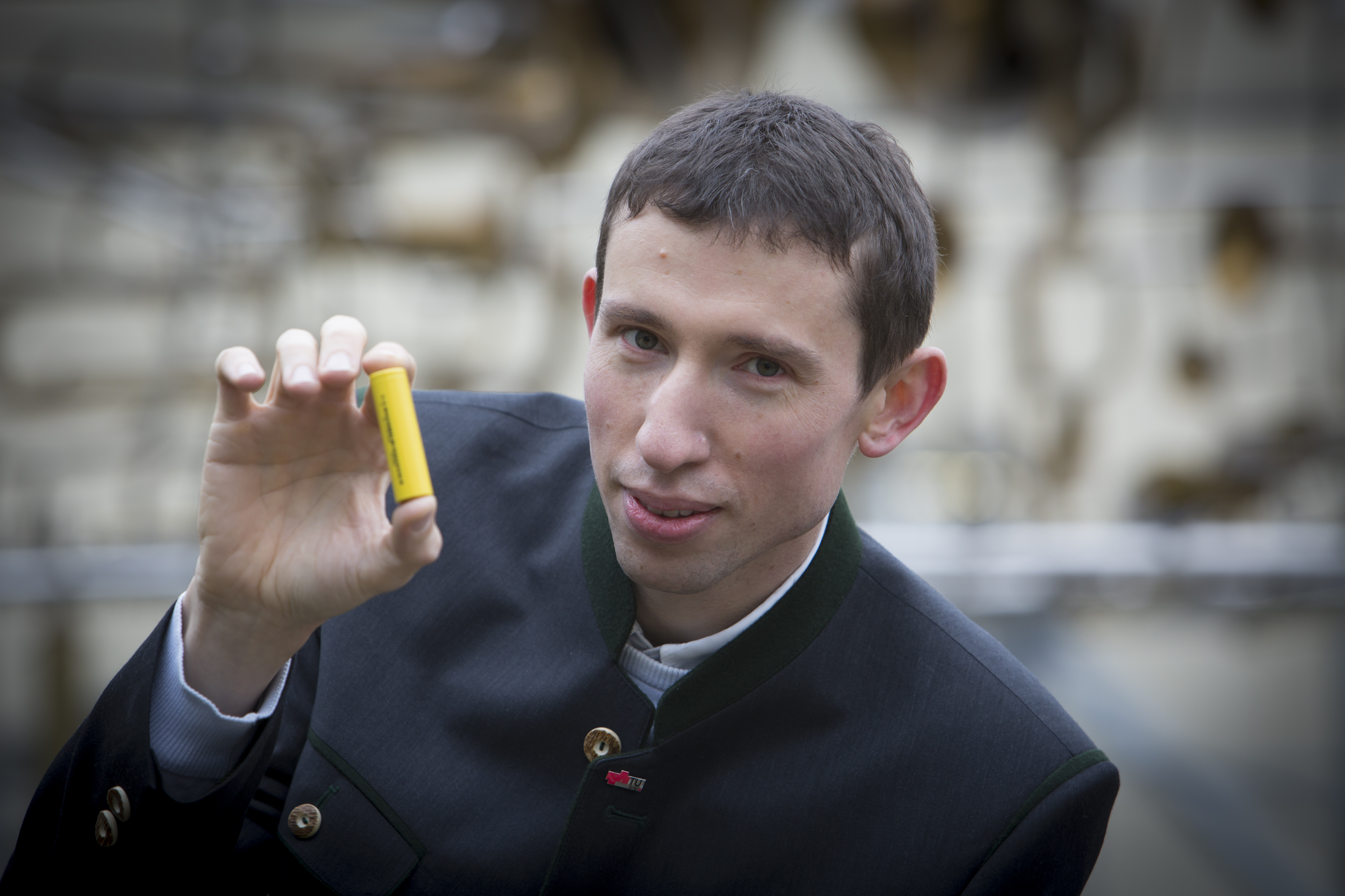 Stefan Freunberger, beneficiary of an ERC Grant at TU Graz, showing a battery.